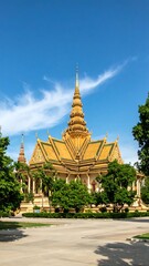 Fototapeta premium Golden temple architecture under a clear sky