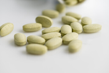 Close up of Sulforaphane Supplement Tablets on White Background