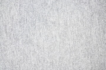Light gray textured fabric surface with a soft and smooth appearance