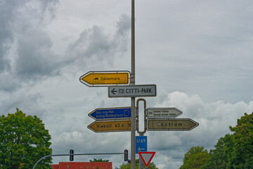 Metal pole in flensburg with many road signs to Zentrum and Denmark