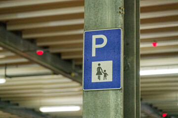 Parking sign with blue P symbol for parents with children