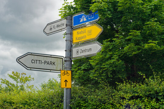 Road signs on pole showing Autobahn A7 Niebull Kapelln and Zentrum