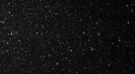 A mesmerizing image of falling snow against a dark backdrop, creating a serene and magical atmosphere. The snow appears as numerous sparkling dots scattered across a dark canvas.