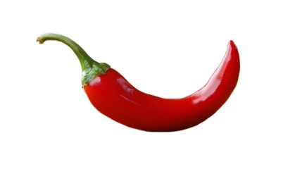 Isolated red chili pepper with a green stem on a black background in a studio shot for a food concept