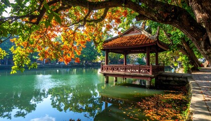 Tranquil scene of a lakeside pavilion in autumn under colorful foliage shades