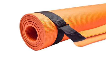 A close up of an orange yoga mat rolled up with a black strap on a black background studio shot