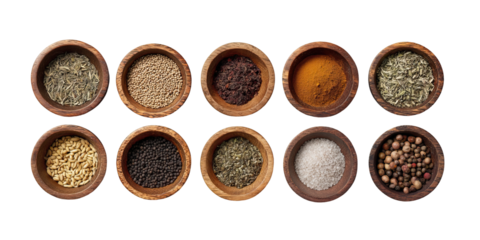Assorted dried spices and herbs in eight wooden bowls on transparent background