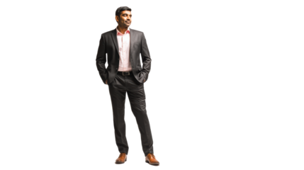 Confident businessman in a suit, standing with hands in pockets, isolated on white background.