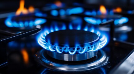 Captivating blue gas flames dance on a modern stovetop, showcasing intense heat and cooking power