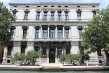 Elegant facade of a historic building along a canal.