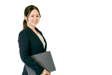 タブレットPC・ノートパソコンを持つアジア人ビジネスウーマン
