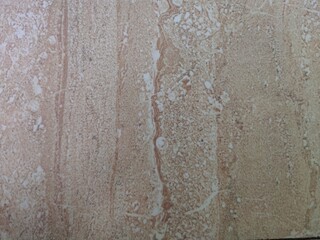 marble surface texture with light brown and cream colored streak patterns