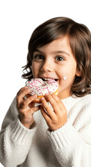 Smiling little girl with brown hair holding and biting donut covered in white icing with pink sprinkles, expression of joy, happy childhood, sweetness and fun concept
