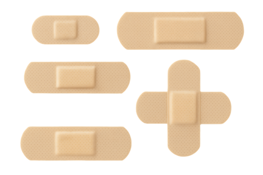 A collection of various adhesive bandages in different shapes and sizes for medical and first aid purposes, isolated on a transparent background