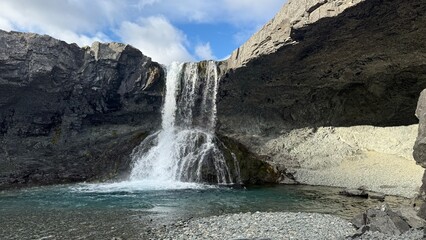 icelandic waterfall in the mountains