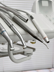 Modern dental tools arranged neatly for an efficient dental procedure in a well-lit clinic...