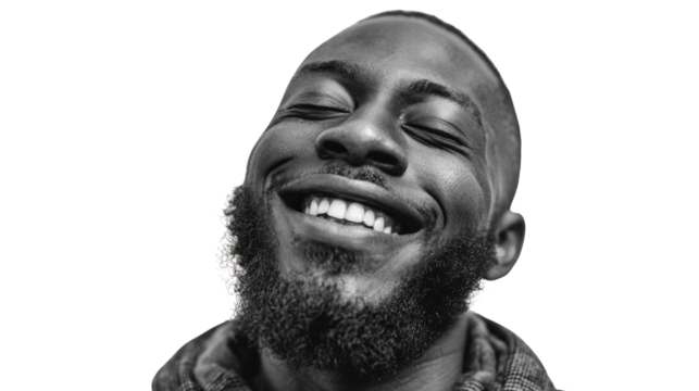 Happy man with a beard smiling joyfully against a white isolated background.