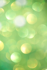 Colorful bokeh glitter sparkle light green gold background