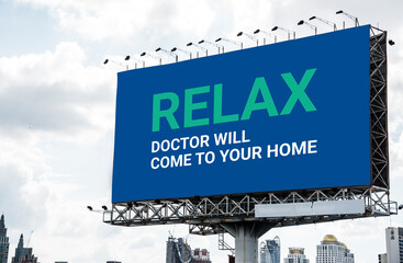 A large billboard on a busy urban street advertising a convenient home doctor visit service. The...