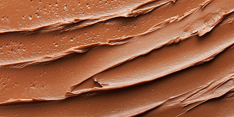 Close up texture of creamy chocolate spread background, smooth sweet cocoa hazelnut paste surface, delicious dessert ingredient pattern