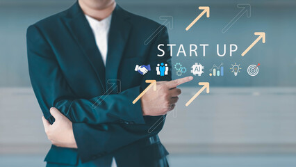 A businessman in a suit points to a virtual 