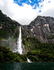Majestic waterfall cascading down rocky mountains (2)