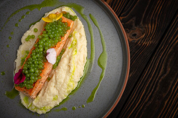 Salmon Fillet with Protein Caviar, Puree and Edible Flowers
