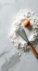 Flour, egg, whisk on marble (1)