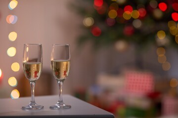 glasses of champagne on christmas background