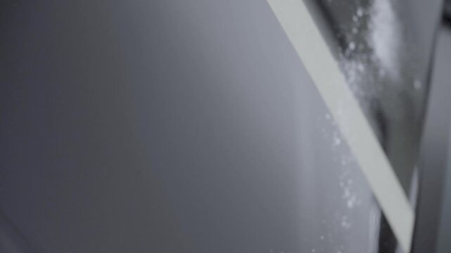 Use an air gun to blow off the dust on the car paint