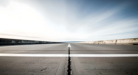 Empty Asphalt Road with White Lines Under Bright Sky
