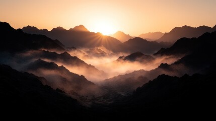 Obraz premium Majestic Sunrise Over Misty Mountain Ranges A Breathtaking Panorama