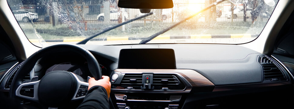 Clean the car window windshields with the car wipers