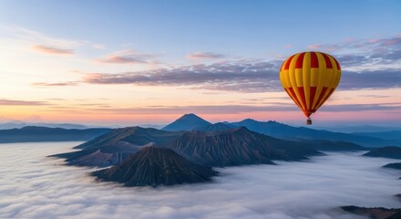 A hot air balloon floats over a misty mountain range at sunrise, creating a breathtaking travel scene in indonesia