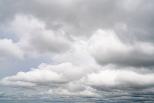 Dramatic overcast sky with gray and white clouds before rainy season storm, moody and gloomy weather background. Climate, meteorology, and atmospheric. Weather forecasting, climate change background.