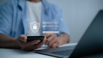 Businessman using smartphone and laptop with digital login interface, symbolizing cybersecurity, password protection, online privacy, secure access and data safety in modern technology