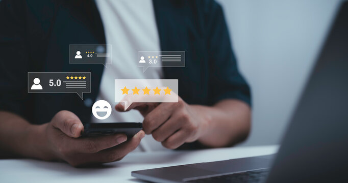 Businessman using smartphone with digital customer review and star rating icons, representing online feedback, satisfaction, reputation management, service quality and consumer experience