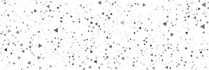 Scattered grey and black triangles on a white background 