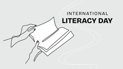 Continuous line drawing of a hand holding an open book for Literacy Day