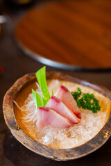 Japanese Sashimi Menu hamachi sliced ​​on ice in the restaurant.