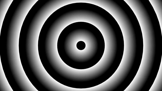 A mesmerizing video showcasing a black and white concentric circle pattern in a dark background