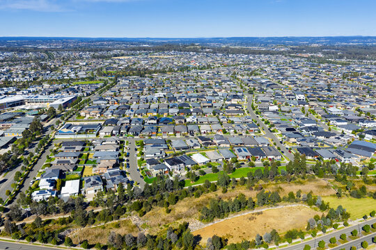Drone aerial photograph of residential houses and neighbourhoods in the fast growing suburb of Oran Park in the Macarthur Region of South Western Sydney in New South Wales, Australia. 