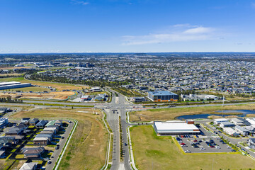 Drone aerial photograph of residential houses and neighbourhoods in the fast growing suburb of Oran Park in the Macarthur Region of South Western Sydney in New South Wales, Australia. 