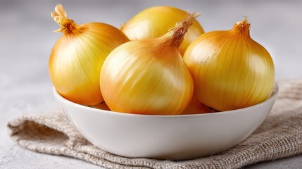 Yellow Onion in a Bowl on a White Background with Space for Copy or Text