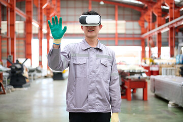 Engineer or technician wearing virtual reality glasses(VR) in the factory