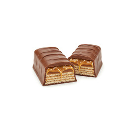 Halves chocolate bar with caramel and wafer filling isolated on white background.