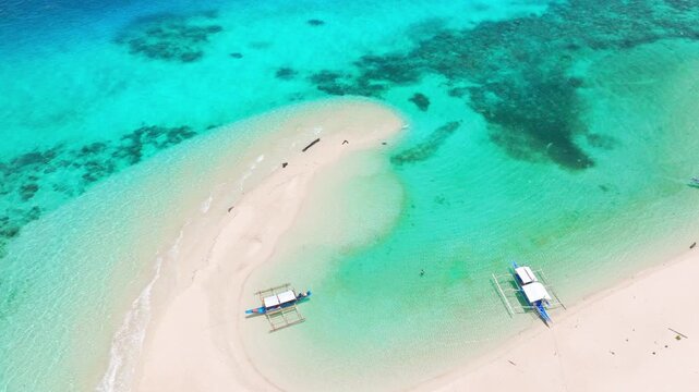 Witness the stunning aerial perspective of Balabac's clear waters, white sandy beaches, and tropical scenery from above. Seascape drone footage like never before.