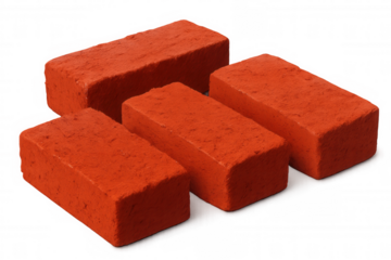 Red construction bricks stacked neatly, resting on clean transparent surface