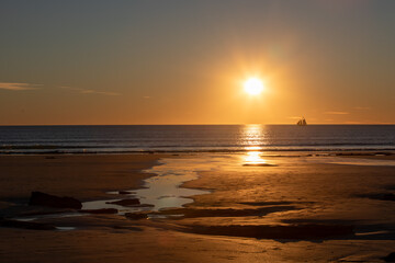 Spectacular sunset at Cable beach in Broome, Western Australia.