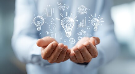 Obraz premium Hands holding a lightbulb graphic overlay